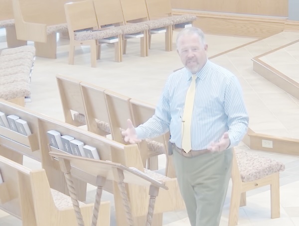 Bible study leader teaching in the church sanctuary